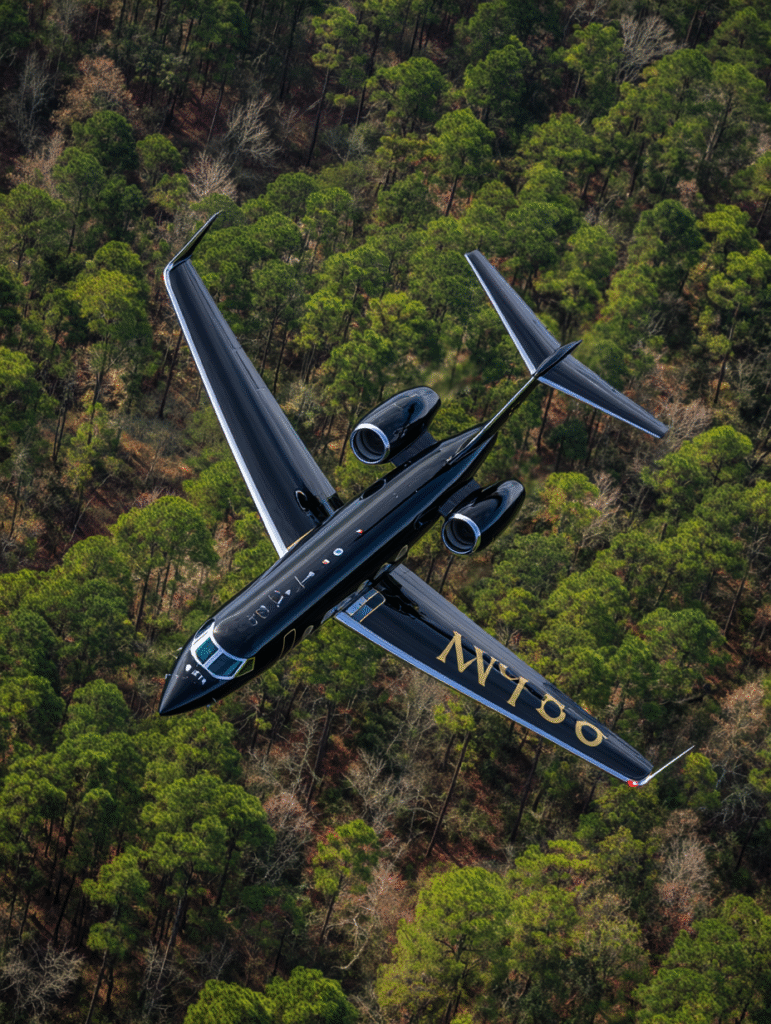 A sleek black Gulfstream jet flying low over the pine coverd d37eb14b 57b4 4650 9035 498f133f03fb 3